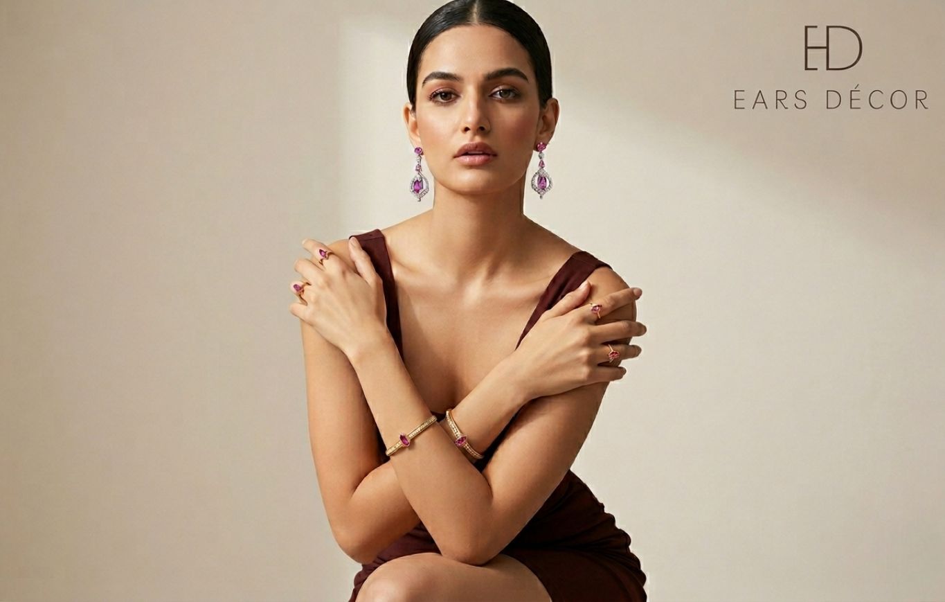 Model wearing pink ruby and diamond chandelier drop earrings by Ears Décor