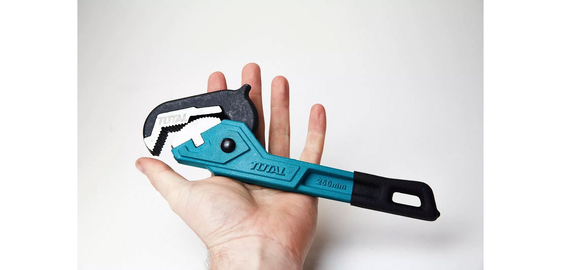 Total Tools Ratcheting Pipe Wrench 10" in hand for size reference