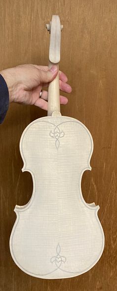 Back of handmade five-string fiddle with mineral ground, handcrafted in Oregon by artisanal luthier, Chet Bishop