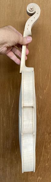 Side view, handmade five-string fiddle with mineral Ground, handcrafted in Oregon by Artisanal Luthier, Chet Bishop