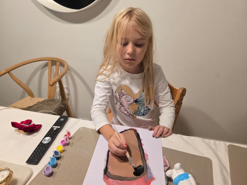 Iris creating her drawing