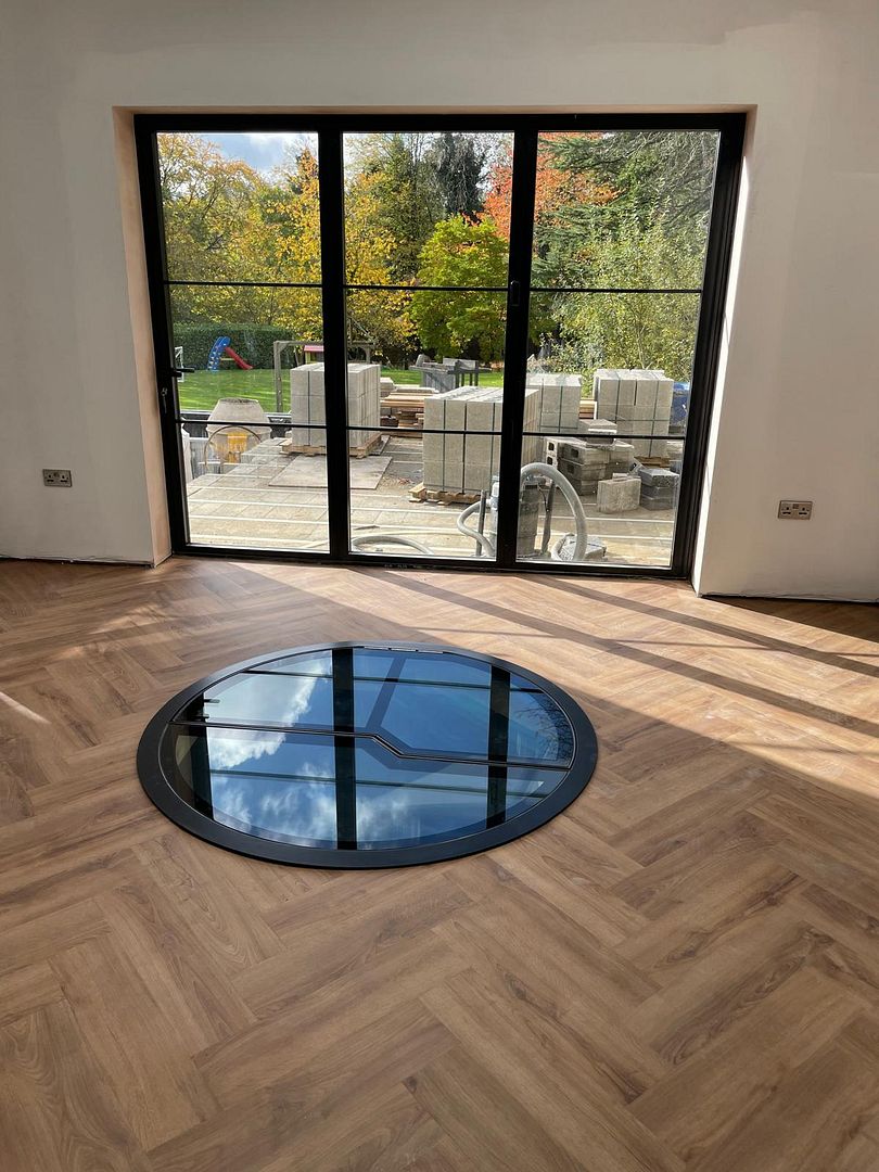 automated wine cellar glass door hatch to spiral staircase