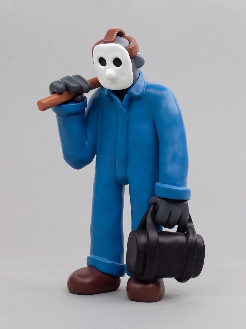 Spooky Woods Duffle sculpture in blue coveralls with a black duffle bag