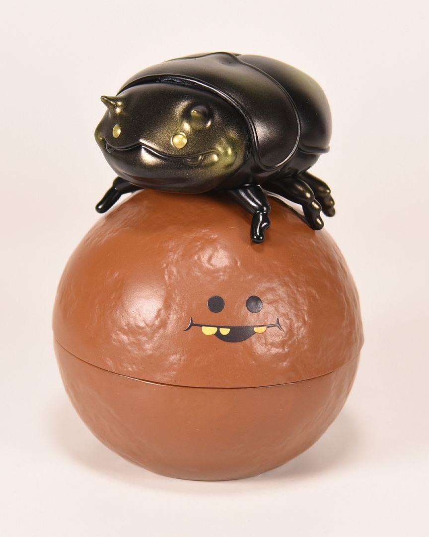 Andrew Bell Metallic Sheen Dungby in black and metallic green with brown Pooba