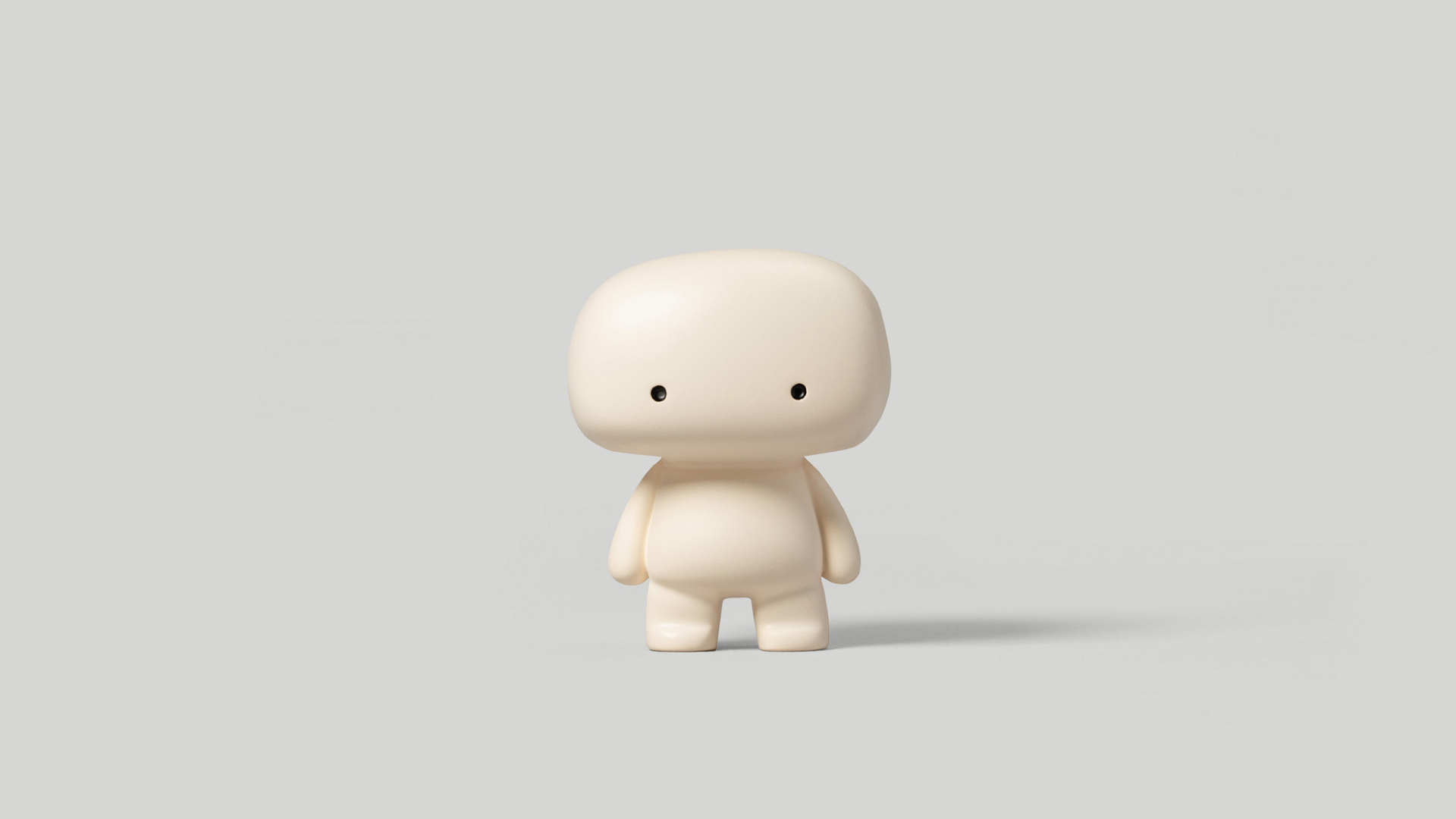Studio blumo totem 2-inch matte cream resin art figure, front view