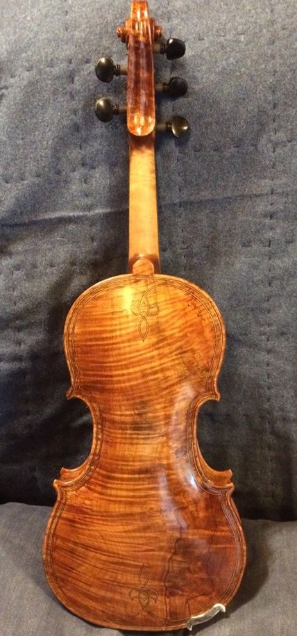 Oliver acoustic Five String Fiddle back, with wild Oregon Maple flame. Handmade in Oregon by Chet Bishop.