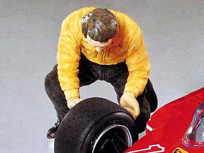 Motor racing team mechanic (wheel changing)