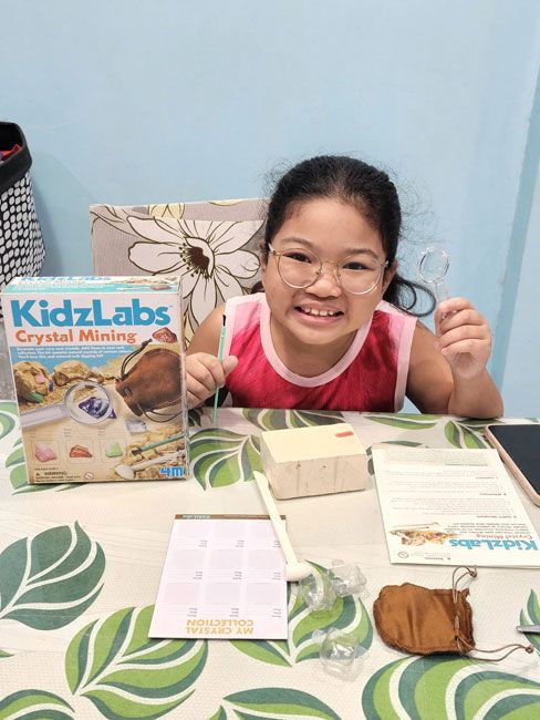 Twinkle holding her Kidzlabs crystal mining kit