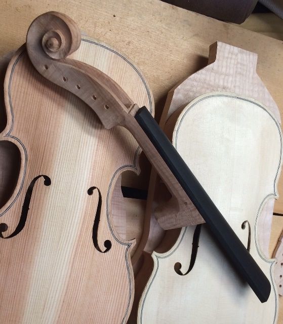 neck and fingerboard with five-string fiddles by Chet Bishop, Luthier.