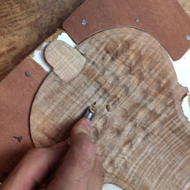 Carving the back plate for the Five String viola.