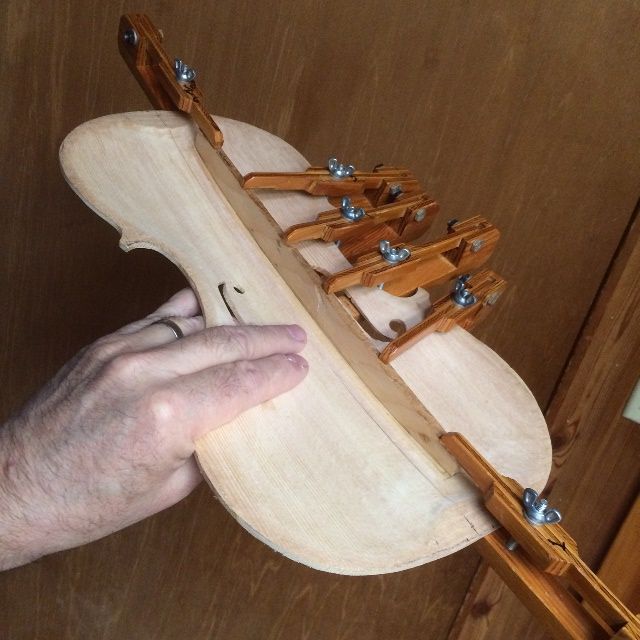 Fitted, glued and clamped bass-bar on a Five-string viola.