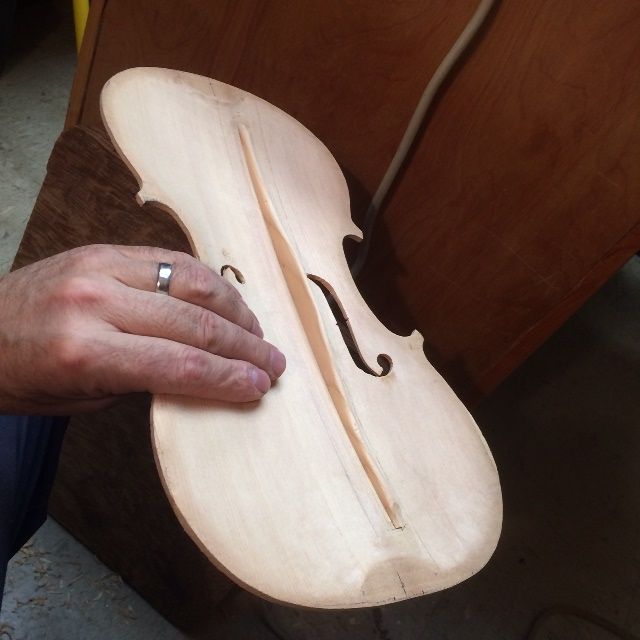 Completed shaped of finished bass-bar for a Five-string viola.