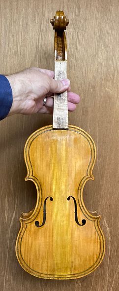 First color coat on front of 5-string fiddle handcrafted in Oregon by artisanal Luthier Chet Bishop