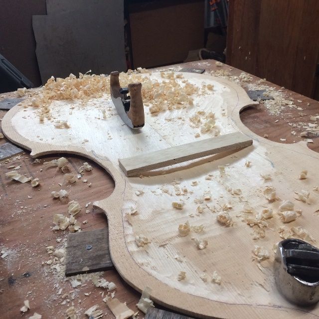 Rough-carving the interior of the Five-string Double Bass front plate.