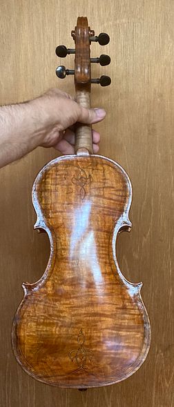Back side of five string bluegrass fiddle handcrafted in Oregon by artisanal luthier Chet Bishop.