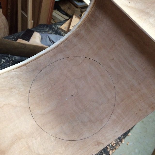 Side access hole laid out for a five-string double bass with removable neck.