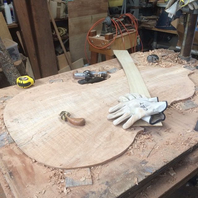 Arching of the five-string double bass back plate underway.