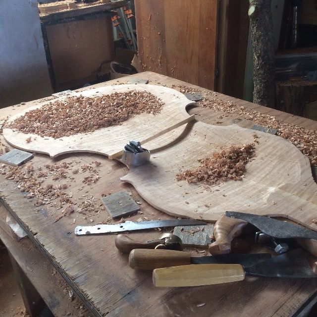 Beginning the inside carving of the back plate for the five-string double bass.