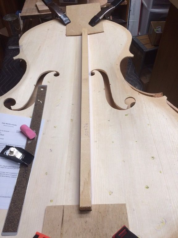 Fitting fixtures for fitting the bass-bar on a five-string double bass.