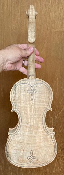 Button and heel carved to match, on 5-string fiddle handcrafted in Oregon by artisanal luthier, Chet Bishop.