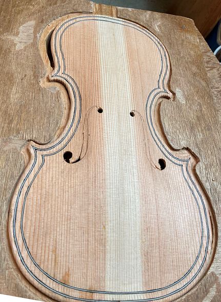 Beginning to cut out f-holes for a 5-string bluegrass fiddle handmade in Oregon by Chet Bishop, Luthier.