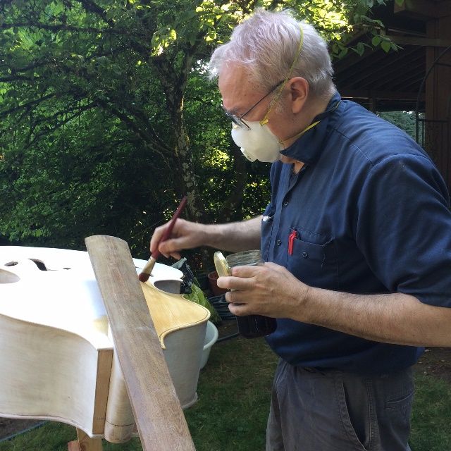 Sealing the front plate of a five-string double bass.