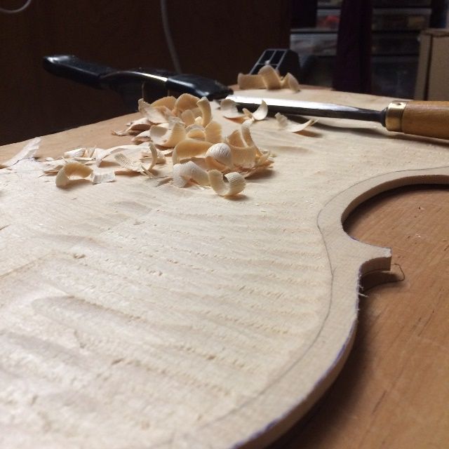 Carving away the waste wood from the interior of the 16-1/2" five-string Viola.