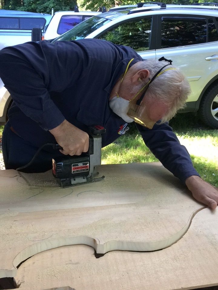 Cutting out the completed shape of the front plate for the five-string double bass.