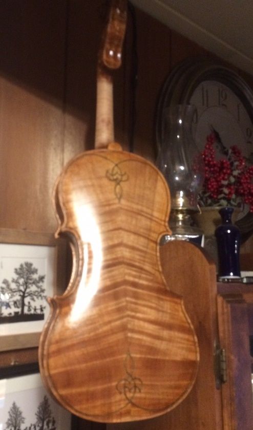 Back view of handmade Oregon 5-string fiddle with early varnish coats.