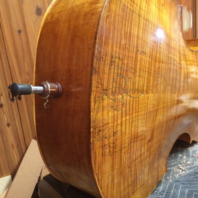 Endpin assembly installed on five-string double bass.
