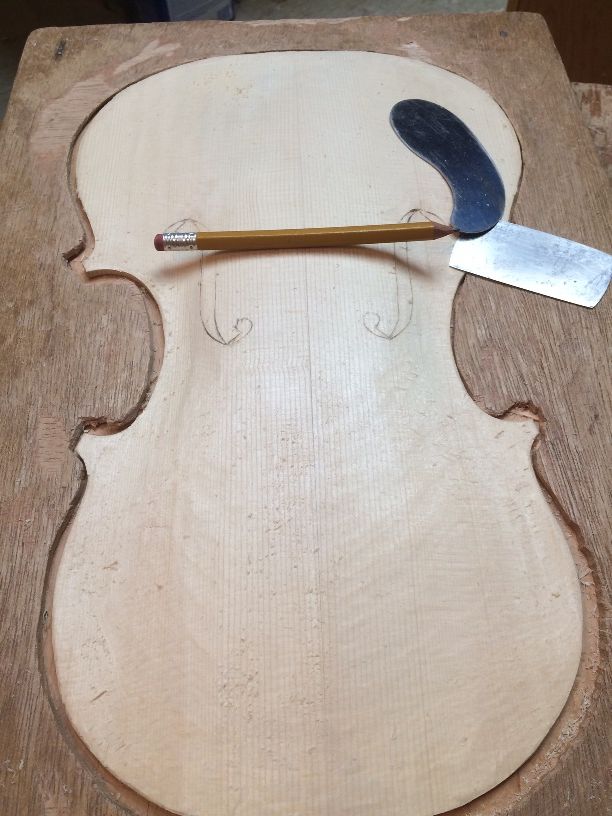 refining the arching on a 5-string bluegrass fiddle handmade in Oregon by Chet Bishop