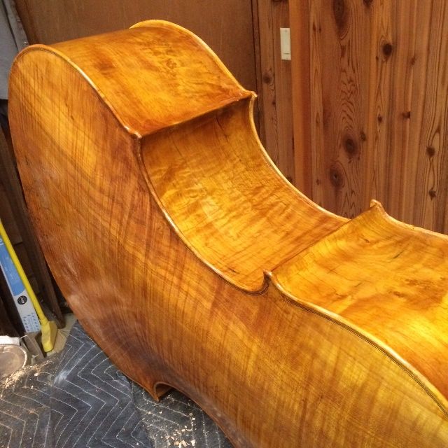 Final color coat for five-string double bass in the making.