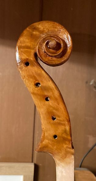 Scroll of handmade bluegrass five string fiddle, handcrafted in Oregon by artisanal luthier Chet Bishop