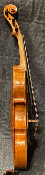Side view of a five-string bluegrass fiddle, handcrafted in Oregon by artisanal Luthier Chet Bishop.