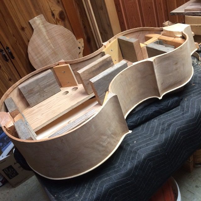 Front plate and garland for five string double bass.