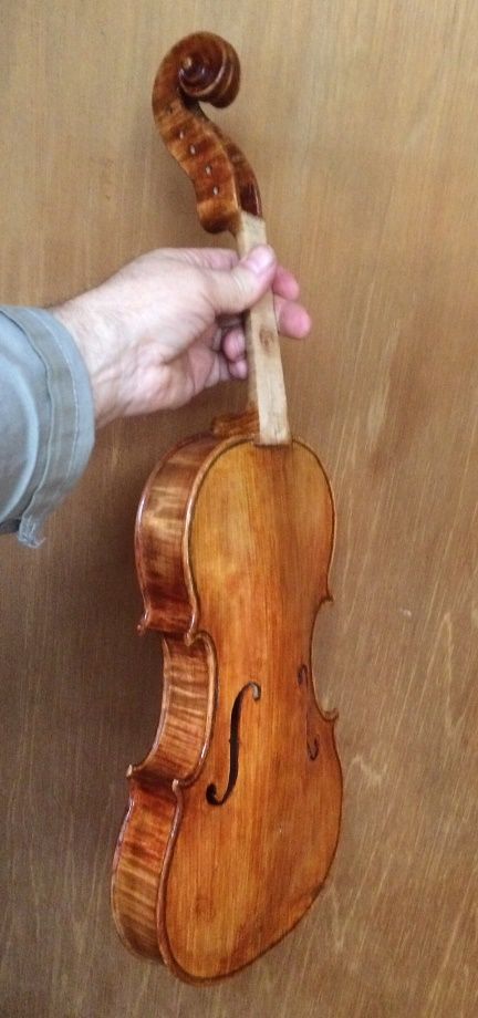Front view of Handmade Bluegrass 5-string fiddle with later layers of varnish.