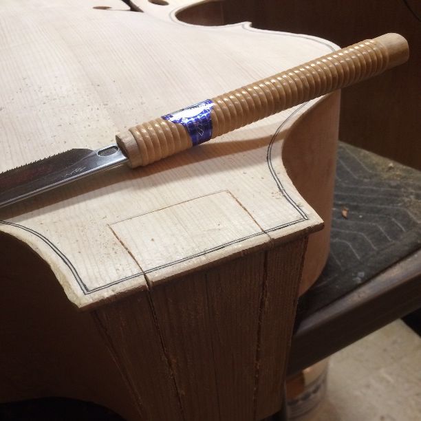 Sawing the neck-mortise for a five-string double bass.