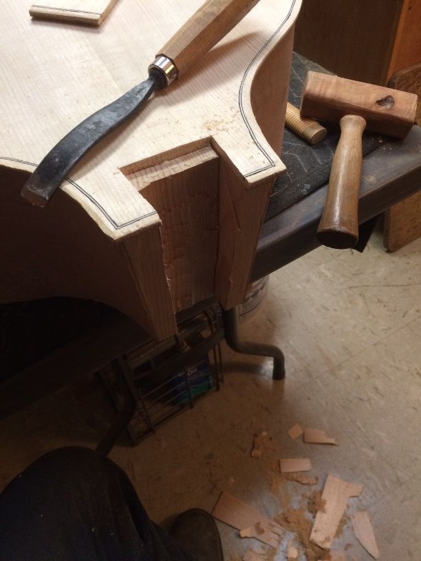 Chiseling out the neck-mortise for a five-string double bass.