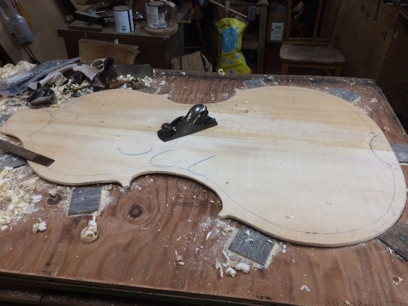 Ready to carve the front plate graduations of the five-string double bass.