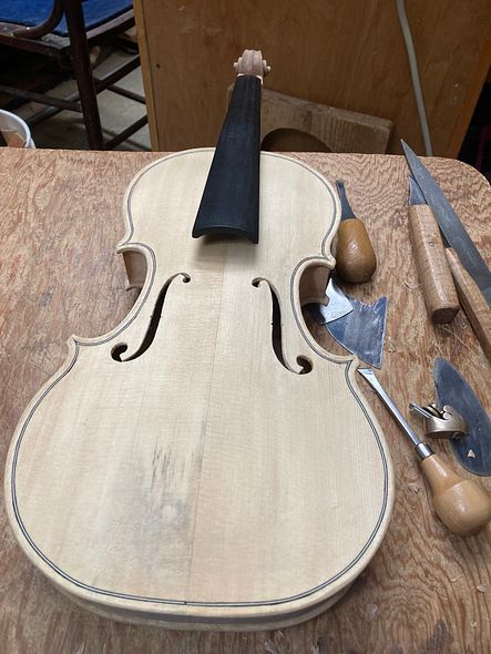 Completed front view of five string fiddle by Chet Bishop.