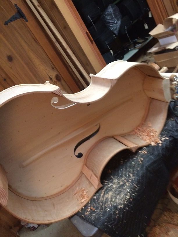 Shaping the blocks in a 5-string double bass.