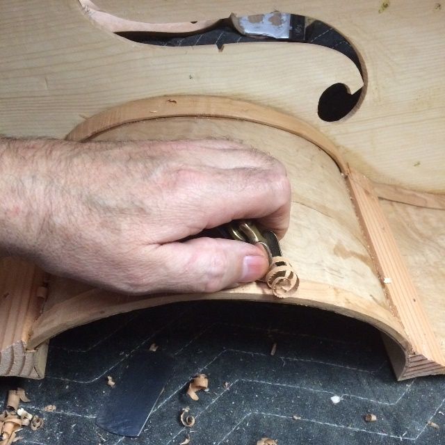 Planing the ribs to shape in a five-string double bass.