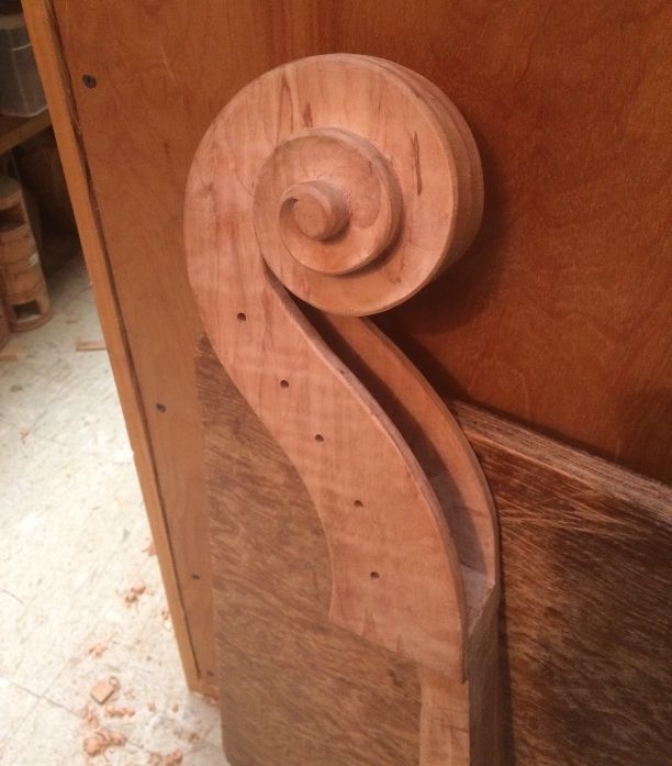 Scroll for a five-string double bass nearing completion.
