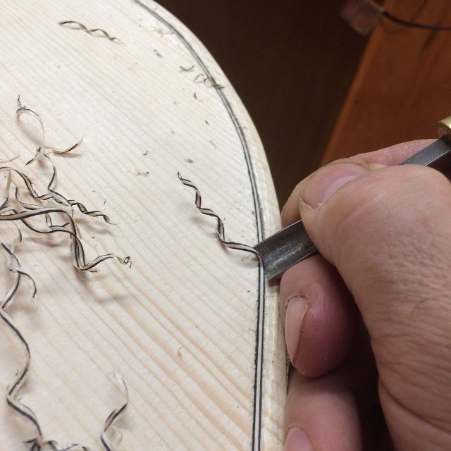 Using a gouge as a drawknife, to carve the channel.