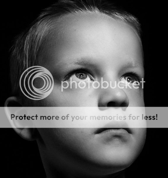 A somber looking child