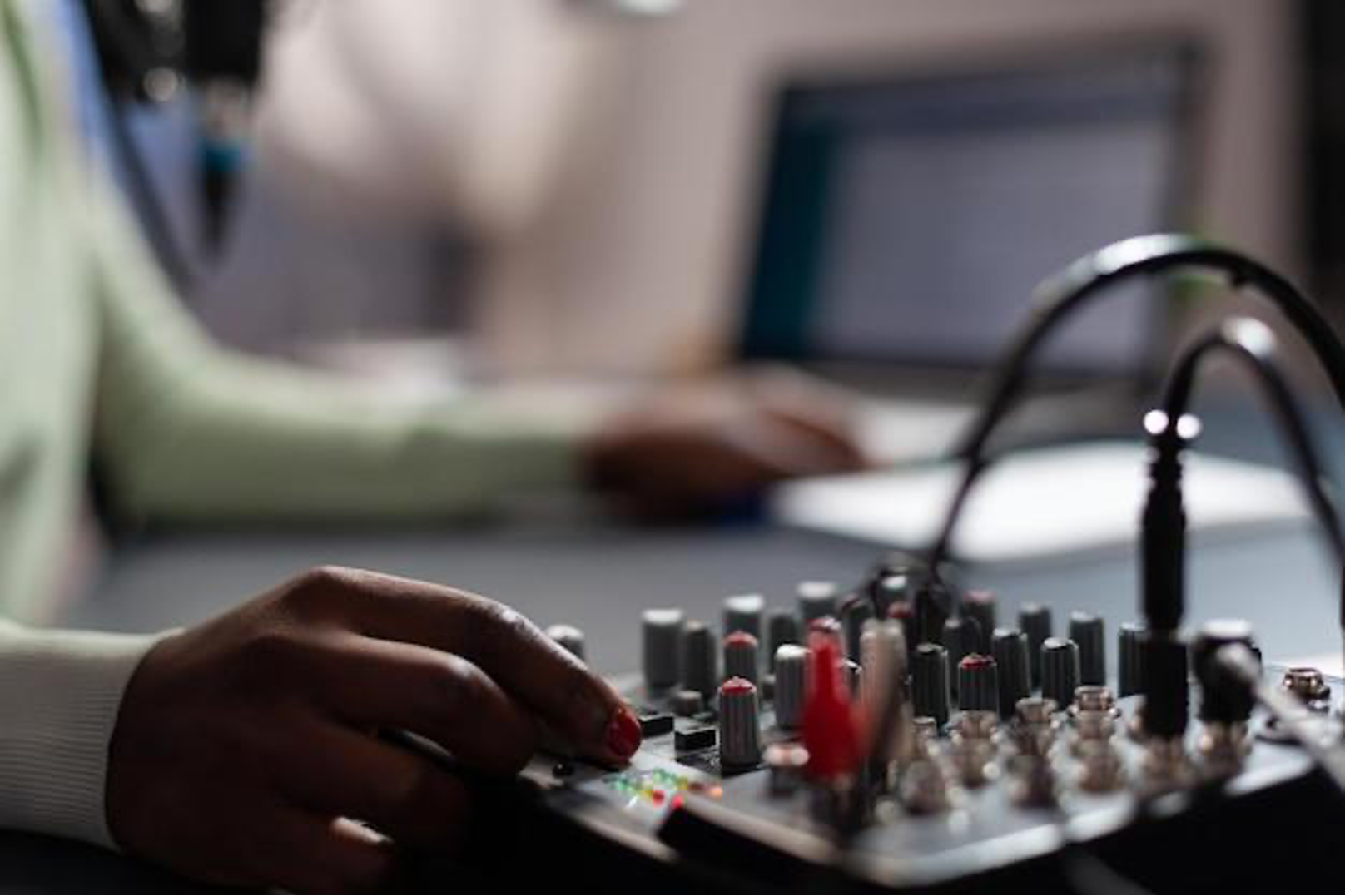 Free photo closeup of influencer woman checking sound of professional mixer while recording online vlog talking with subscribers using microphone. content creator filming video for social media. on air talk show