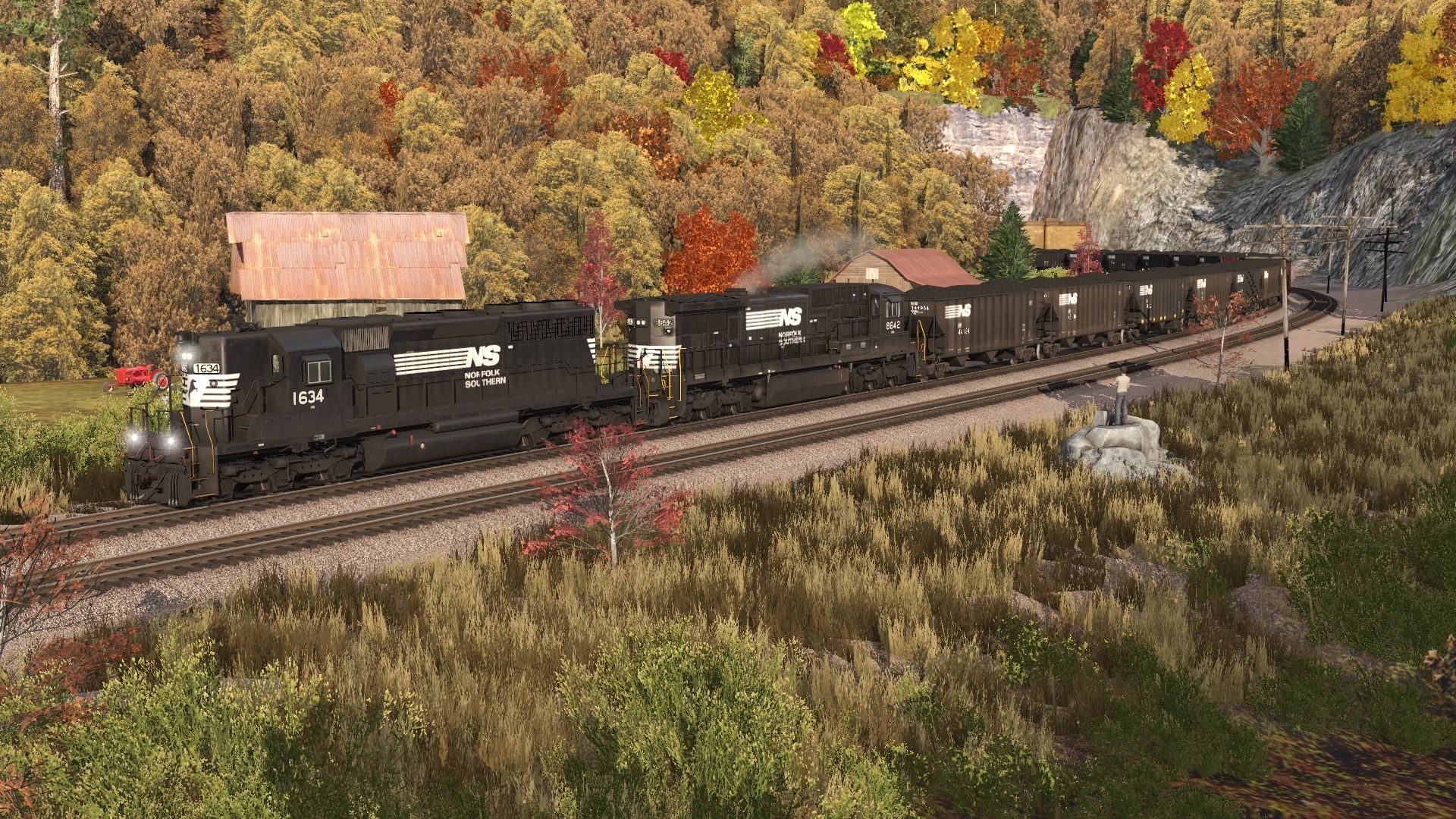 A-10_000_-ton-coal-train-crests-the-grade-at-Hilltop-behind-a-pair-of-aging-motors..jpg