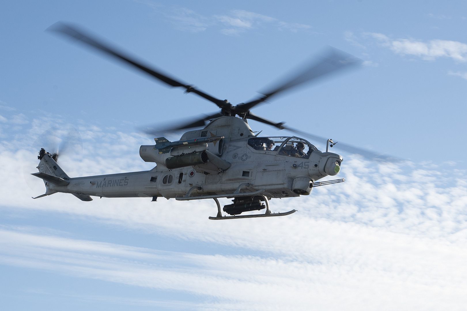 1Z Viper Helicopter Assigned To Marine Light Attack Helicopter Squadron 369 Flies Over Amphibious Assault Carrier USS Tripoli 1Z Viper Helicopter Assigned To Marine Light Attack Helicopter Squadron 369 Flies Over Amphibious Assault Carrier USS Tripoli