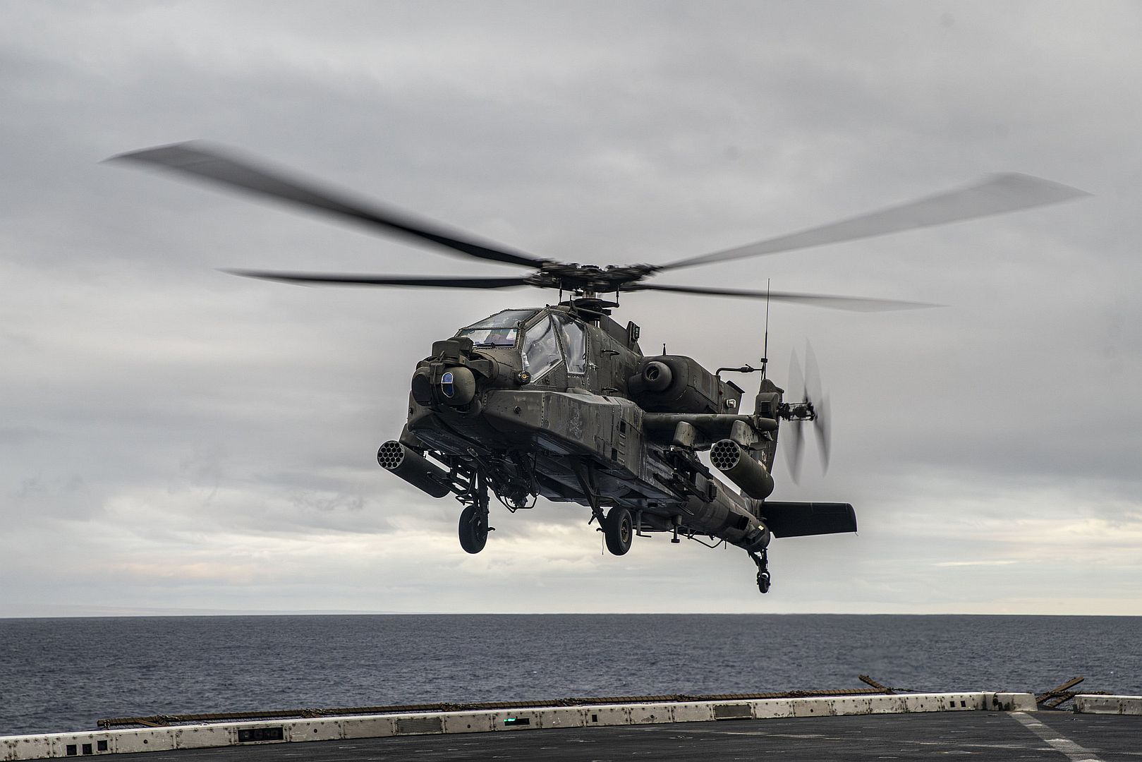 64 Apache Attached To 3rd Battalion 25th Aviation Regiment 25th Combat Aviation Brigade 25th Infantry Division Hovers Above The Flight Deck Aboard The Amphibious Transport Dock USS Somerset 64 Apache Attached To 3rd Battalion 25th Aviation Regiment 25th Combat Aviation Brigade 25th Infantry Division Hovers Above The Flight Deck Aboard The Amphibious Transport Dock USS Somerset