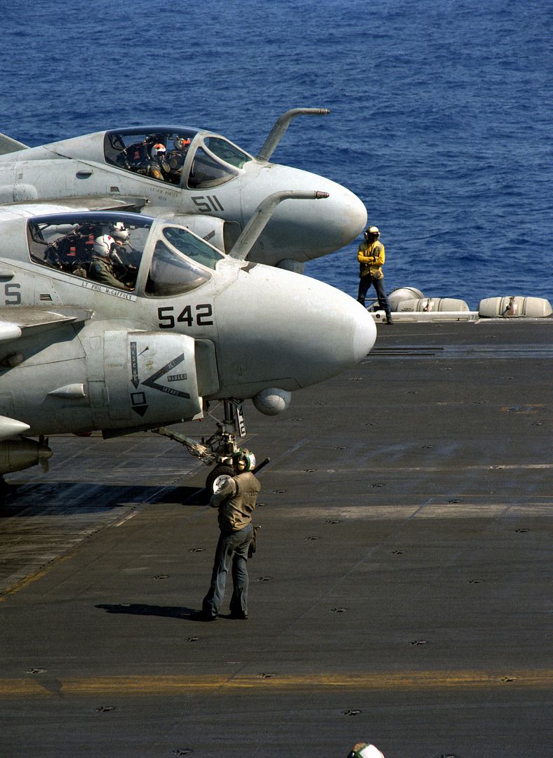 A 6E Intruder Aircraft From Attack Squadron 36 Foreground And Attack Squadron 65 Wait To Taxi Into Position For Launch On The Flight Deck Of The Nuclear Powered Aircraft Carrier USS THEODORE ROOSEVELT